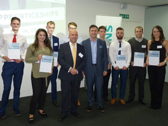 Young apprentices graduate from global firm
