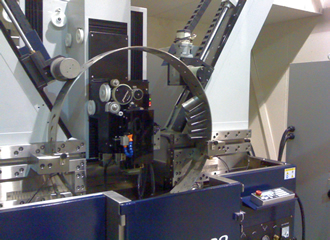 Machine targets ringed turbine blade holder production