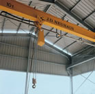 Air driven cranes & crane kits for hazardous area applications