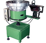 Elscint vibratory feeding system for centreless grinding machines